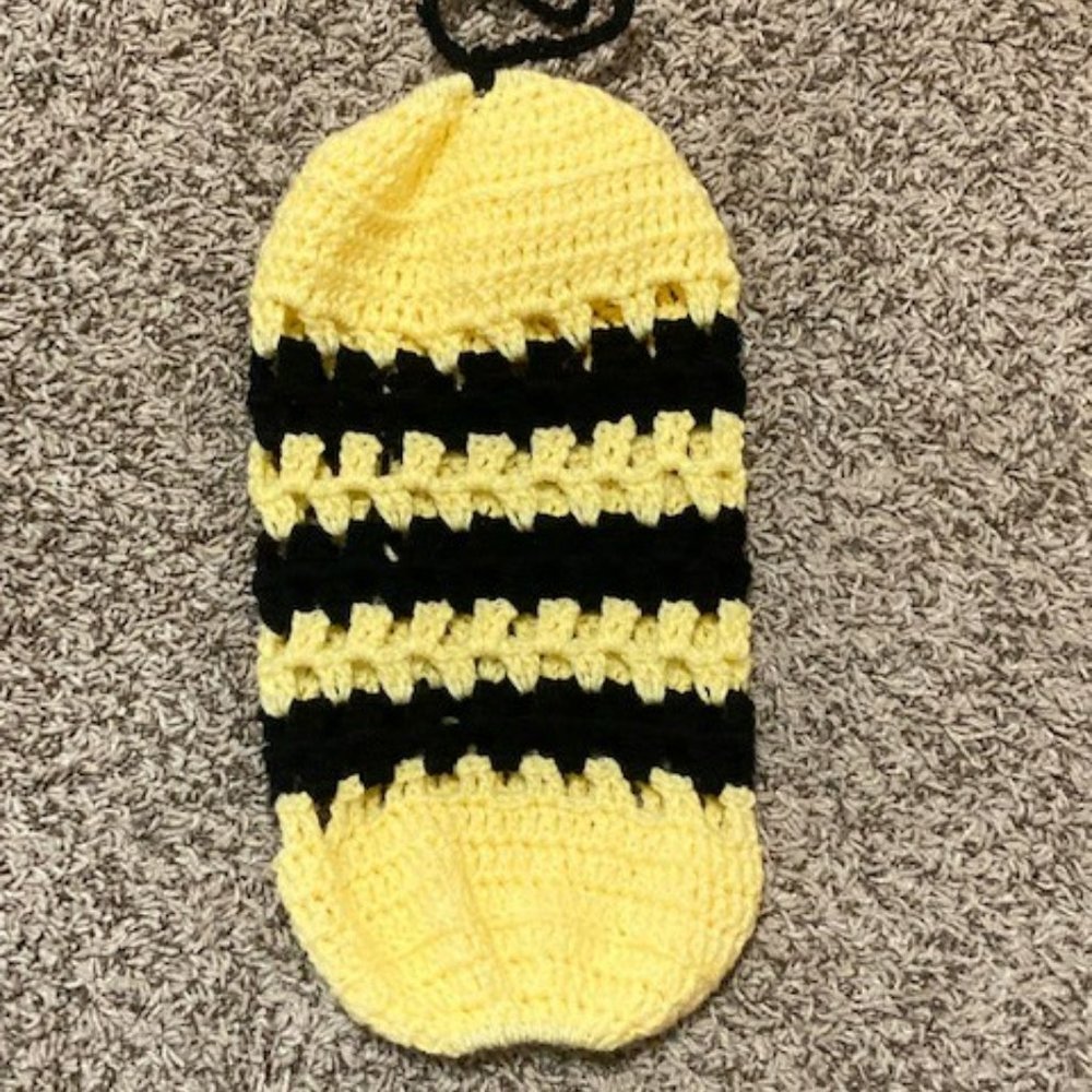 Yellow and black plastic grocery bag holder.